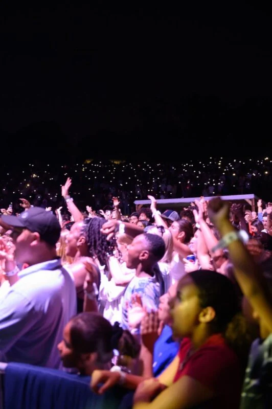 Guests with hands raised in worship at last year's concert